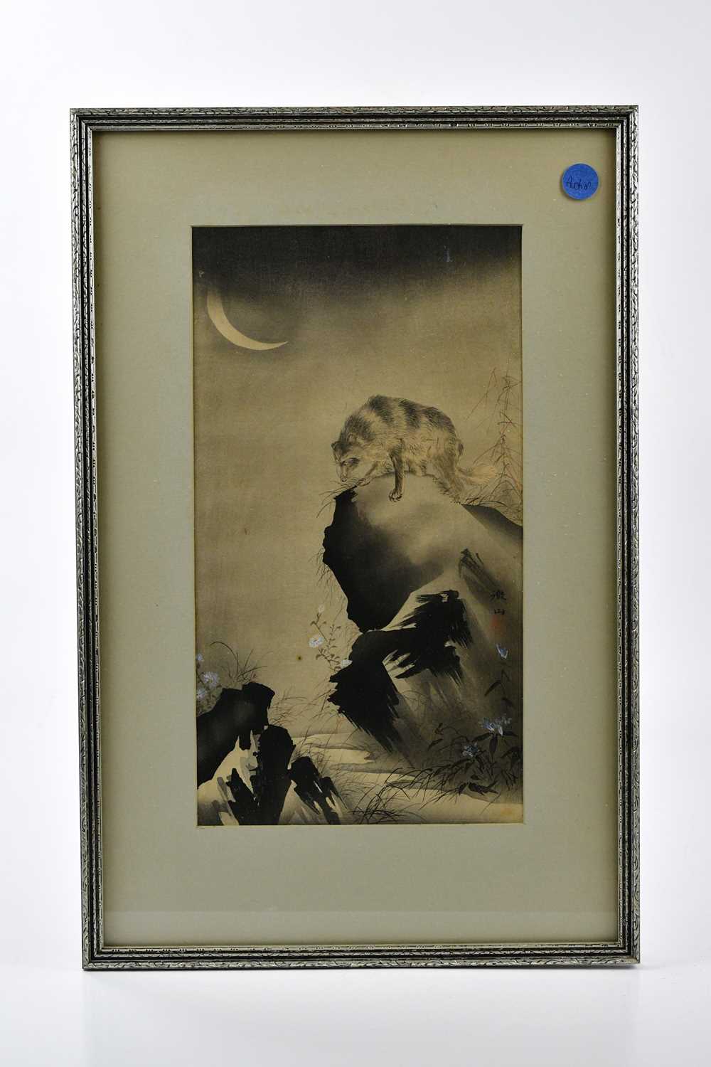 A Japanese wood block print depicting a boar on cliff with crescent moon, 33 x 18.5cm, framed and