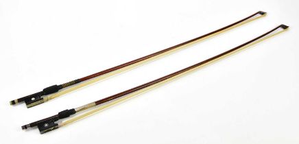 A silver mounted violin bow, stamped Aug. Prager, and a nickel mounted bow (2).