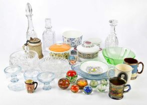 A mixed quantity of cut glass items, including decanters, bowls, and paperweights, with further