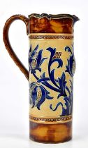 MARK V MARSHALL FOR DOULTON LAMBETH; a cylindrical water jug with embossed decoration with