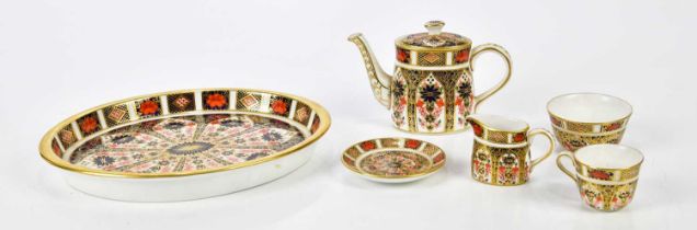 ROYAL CROWN DERBY; a miniature six piece tea service in the 1128 pattern, comprising a teapot, a