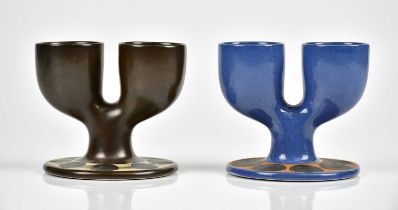 TROIKA POTTERY; two double egg cups, including an unusual blue glazed example within orange band