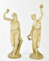 ROYAL WORCESTER; two large blush ivory figures representing maidens holding exotic birds, height