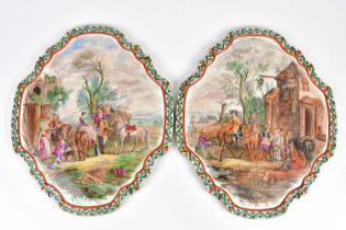 A pair of 19th century hand painted French quatroform plaques decorated with figures on horseback