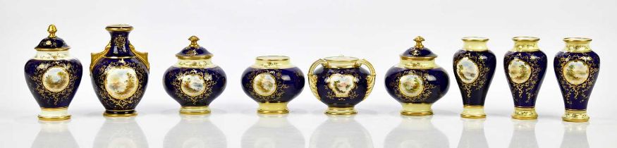 COALPORT; a collection of hand painted and gilt decorated miniature vases and lidded jars, including