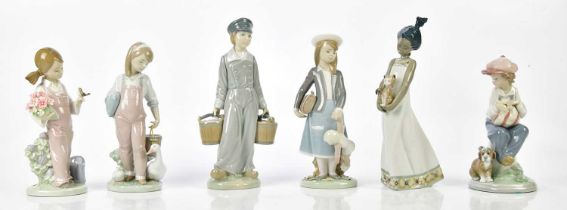 LLADRO; six figures including a young boy. Condition Report: All appear in good condition, the boy