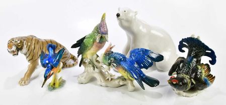 KARL ENZ; two contemporary ceramic models of birds, to include two parrots perching, length 34cm,