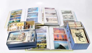 An extensive collection of postcards, loose and contained in four albums, various scenes including
