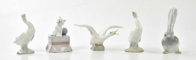 LLADRO; a group of animal figures comprising four birds and a dog model (5).