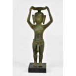 An East Asian bronze figure of a nude male, holding bowl upon his head, on wooden plinth base,