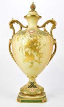 ROYAL WORCESTER; a monumental twin handled pedestal vase and cover, finely decorated with floral