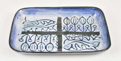 TROIKA POTTERY; a rare and early lasagne tray decorated with stylised fish and flowers, signed