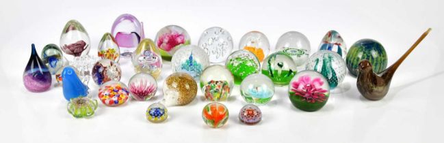 A collection of thirty-two glass paperweights, including Caithness and Scottish examples, also
