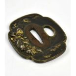 A Japanese bronze tsuba with gilt highlights, approx 7 x 6cm.