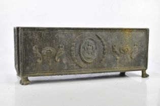 A Regency lead planter of rectangular form, relief decorated to the centre with a twin handled