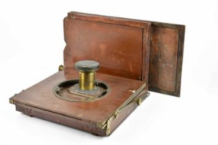 A 19th century part of a plate camera, to include lens and two slides.