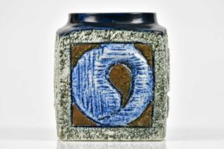 LOUISE JINKS FOR TROIKA POTTERY; a marmalade jar with relief stylised decoration, signed Troika,