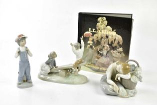 LLADRO; three figures including a figure with seesaw with a book. Condition Report: All appear in