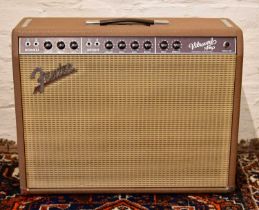 FENDER; a Vibroverb '63 re-issue amplifier, with foot switch, manual and cover.