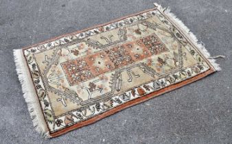 An Eastern style rug, 140cm x 88cm.