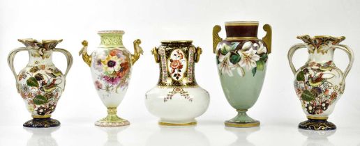 A pair of 19th century twin handled ironstone vases with exotic birds and flowers, height 21cm, with