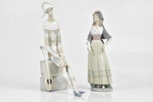 LLADRO; two figure, a jester and a maiden, height of largest 37cm. Condition Report: Both appear