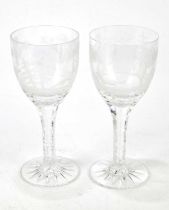 Two identical oversized clear glass goblets, each finely engraved with a landscape featuring a fox