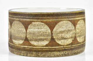 TROIKA POTTERY; a drum bowl decorated with a single band of circles, signed Troika, St Ives,