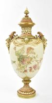 ROYAL WORCESTER; a large and impressive twin handled pedestal vase, the finial cover above