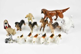 A group of various dog and horse figures to include Beswick, Royal Doulton and Wade examples.