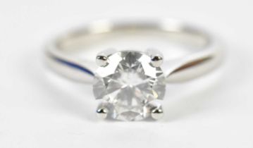 A platinum and diamond single stone ring, the four claw set round brilliant cut diamond approx. 1.