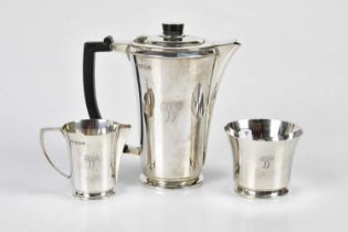GOLDSMITHS & SILVERSMITHS; a George V hallmarked silver three piece tea service in the Art Deco