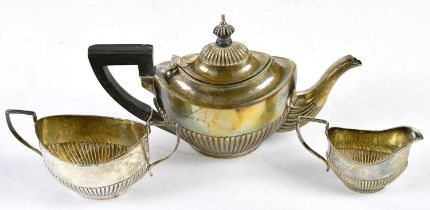 JOSEPH GLOSTER; a late Victorian hallmarked silver three piece bachelor service with gadrooned lower