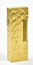 DUNHILL; a gold plated textured rectangular lighter, 6.5cm, unboxed.