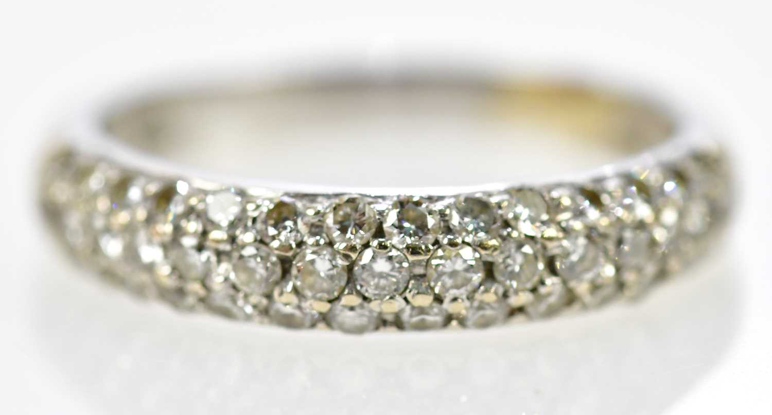 An 18ct white gold brilliant cut pave diamond set three row half eternity ring, size L, approx 4g.