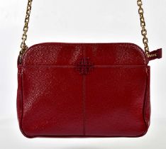 TORY BURCH; a red pebbled patent leather shoulder bag with metal logo to front, gold tone chain