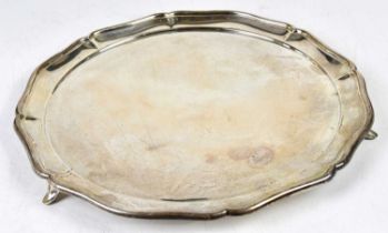 OLLIVANT & BOTSFORD; a George V hallmarked silver circular tray with raised rim and three