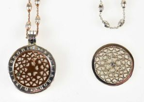 DYRBERG KERN; a set of two interchangeable necklaces, one silver tone with crystals and one rose
