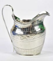 JOHN ROBERTSON; a Georgian hallmarked silver cream jug with chased panelled and scrolling