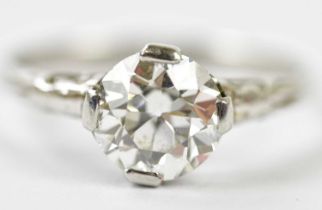 An antique white metal diamond solitaire ring, the four claw set old cut stone approx 1.25cts,