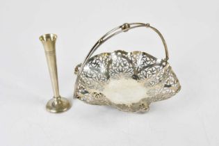 AITKEN BROS; a George V hallmarked silver swing handled cake basket with pierced border on three