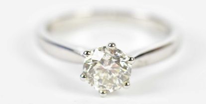 A platinum and diamond solitaire ring, the round brilliant cut six claw set stone approx 1cts,