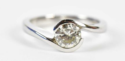 An 18ct white gold diamond solitaire ring, the channel swept set ring approx 1ct, size M, approx