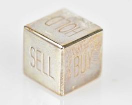 TIFFANY & CO; a loaded silver die inscribed 'Sell, Buy, Hold', presented in Tiffany pouch and