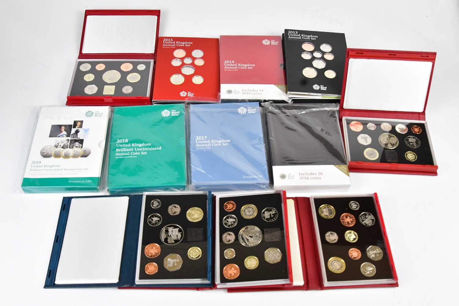 ROYAL MINT; a collection of twelve annual coin sets, comprising 1996, 1997 Deluxe, 1998 Deluxe, 1999