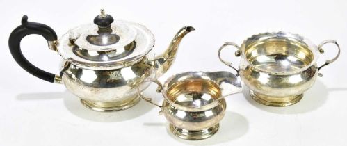 CHARLES BRADBURY & SONS; a George V hallmarked silver three piece bachelor tea set, London 1927,