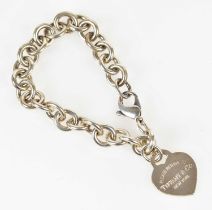 TIFFANY & CO; a sterling silver bracelet with heart shaped pendant, length 18cm, presented with