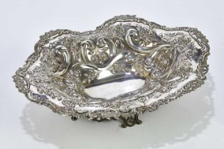 WILLIAM COMYNS; a Victorian hallmarked silver footed bowl of shaped oval form, with pierced and cast