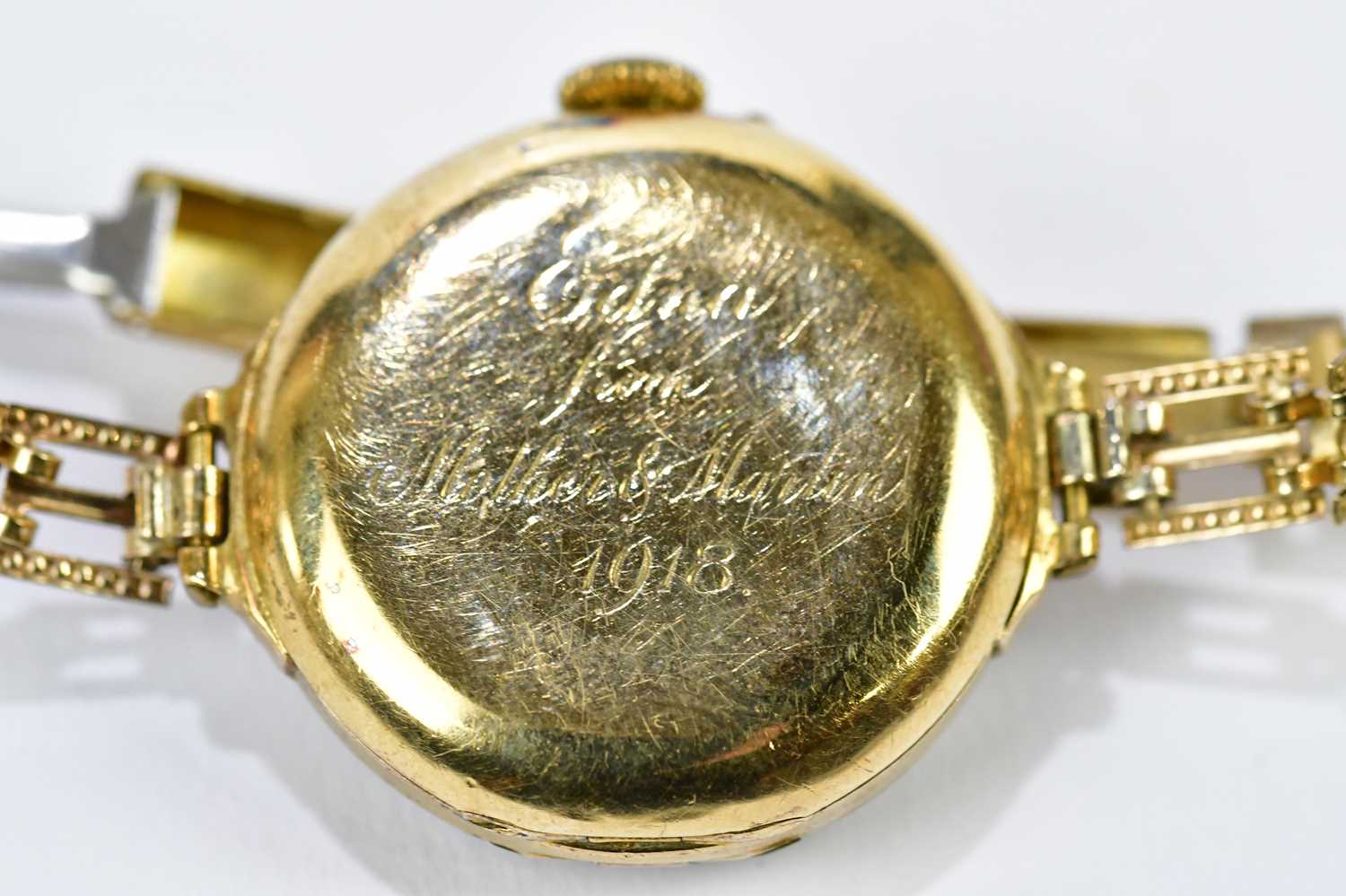 An early 20th century 18ct yellow gold wristwatch with Arabic numerals to the white enamel dial, - Image 6 of 6