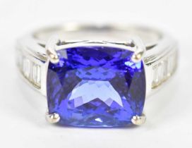 An 18ct white gold tanzanite and diamond ring, the central rectangular cushion shaped mixed cut